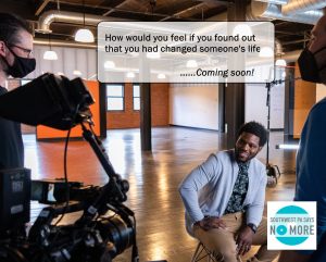 A smiling man dressed for the office is being filmed. Text reads: "How would you feel if you found out that you had changed someone's life? ...Coming soon!" logo of Southwest PA Says No More.